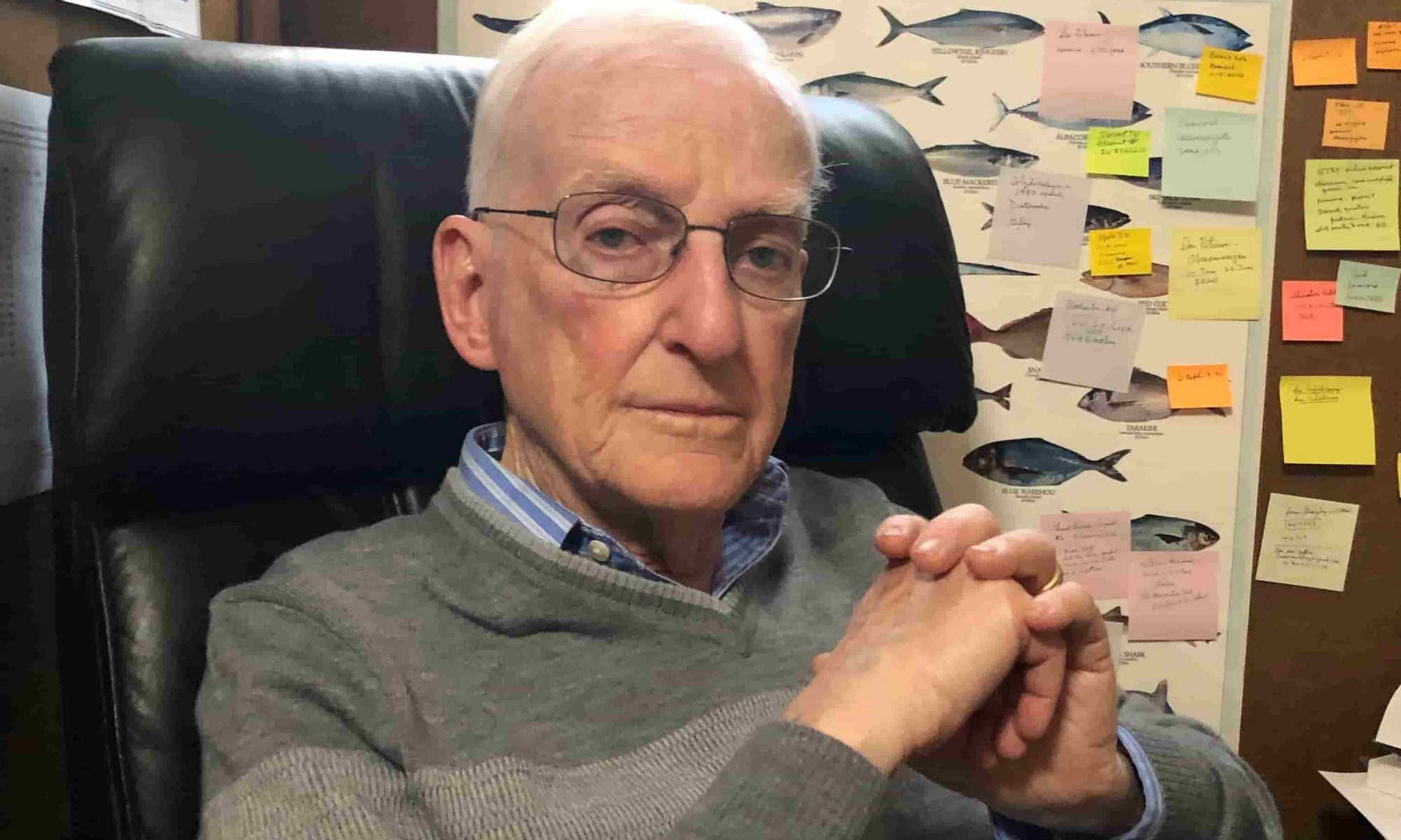 Louis Midgley poses for a photo in a study at his Utah home