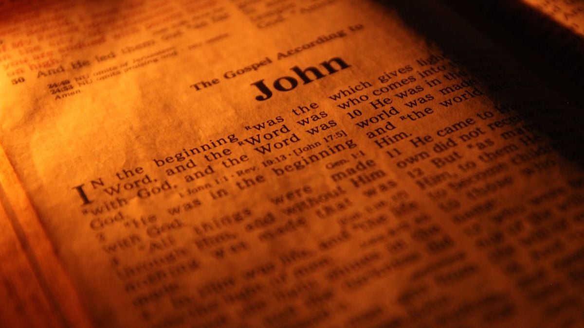 A photograph of a Bible opened to the first page of the Gospel of John, a book loved by BYU scholar Eric Huntsman.