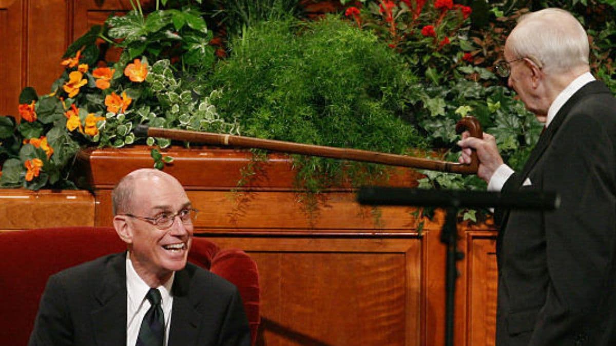 A photograph of Gordon B. Hinckley jokingly "knighting" Henry B. Eyring as a member of the First Presidency.
