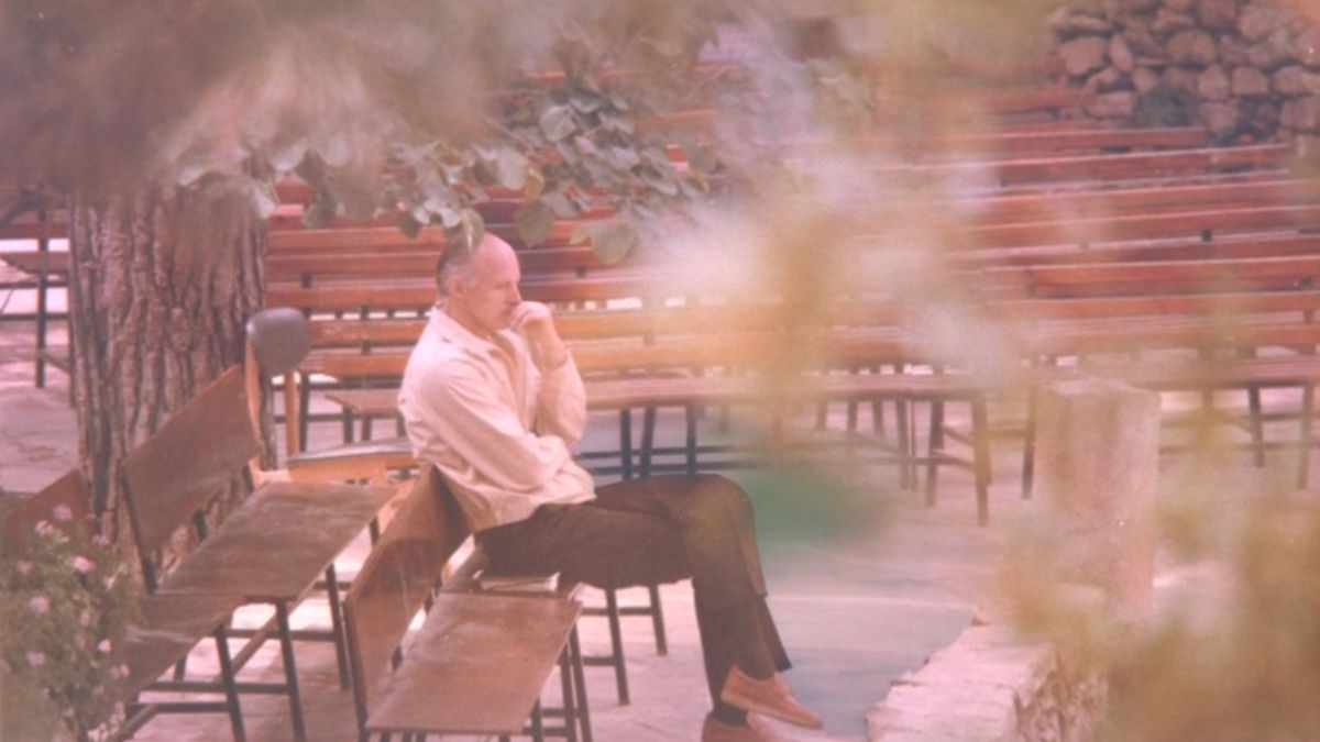 A photograph of Truman Madsen, author of "Twenty Questions," pondering alone.