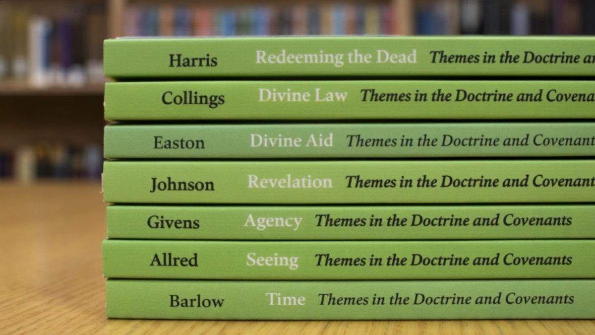 All seven volumes of "Themes in the Doctrine and Covenants" presented on a table at the Maxwell Institute at BYU.