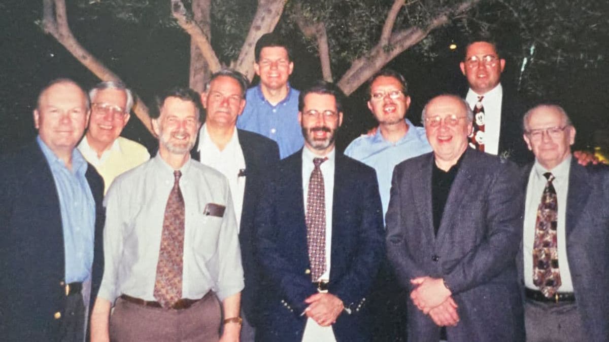 A group photo of Robert L. Millet, Richard Mow, and many other interfaith leaders.