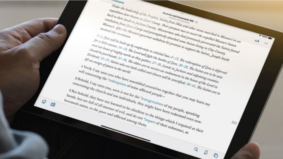 A photo of someone reading D&C 106 on a tablet, illustrating the 2025 updates to Latter-day Saint scriptures such as the Doctrine and Covenants, Book of Mormon, and Study Helps.